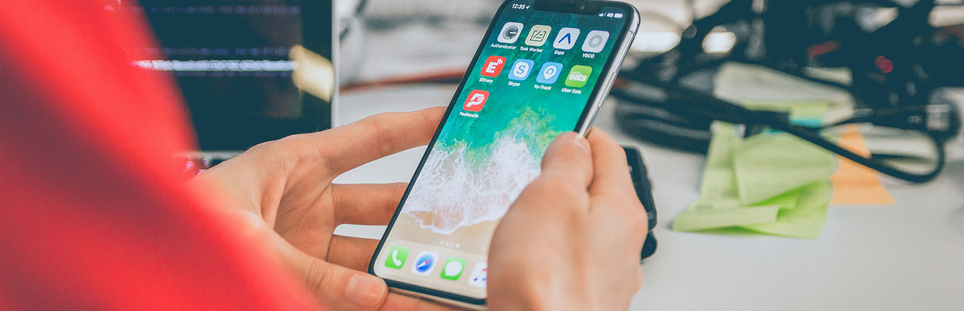 Someone scrolling their phone for apps 
