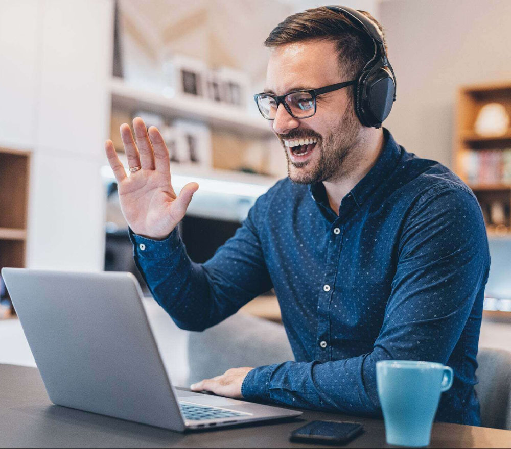 Website Training Online A man waving on an online training call