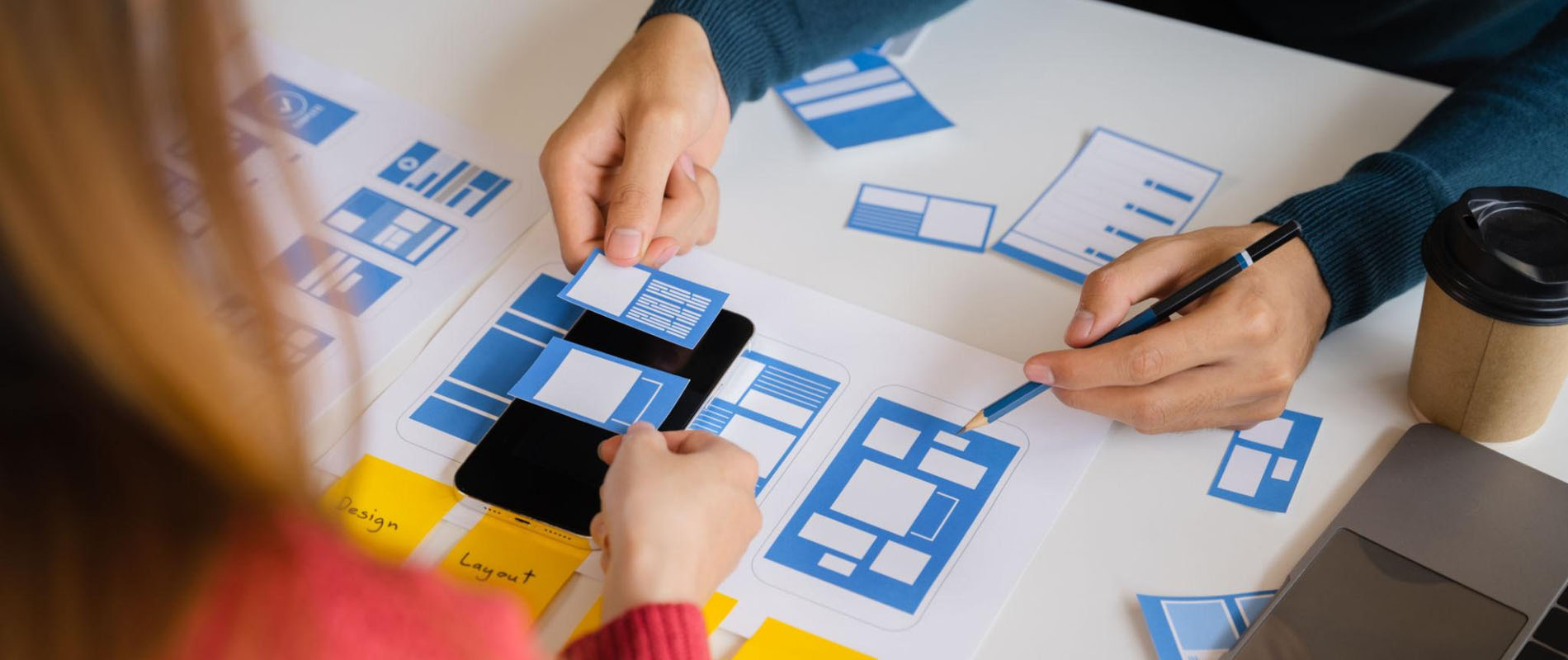 Web Design Agency Collaboration A team of designers at a Web Design Agency creating a wireframe view for a website