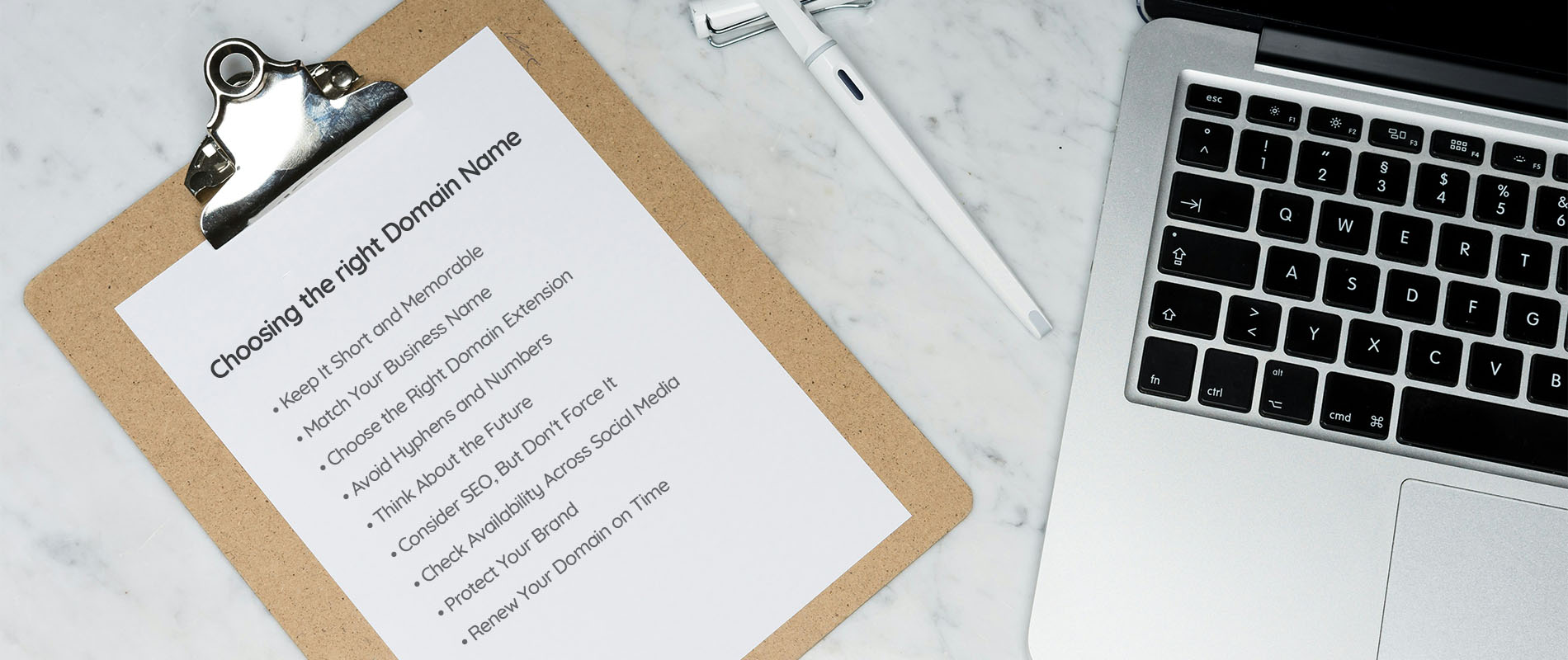 A clipboard showing a list of tips for choosing the correct business domain name